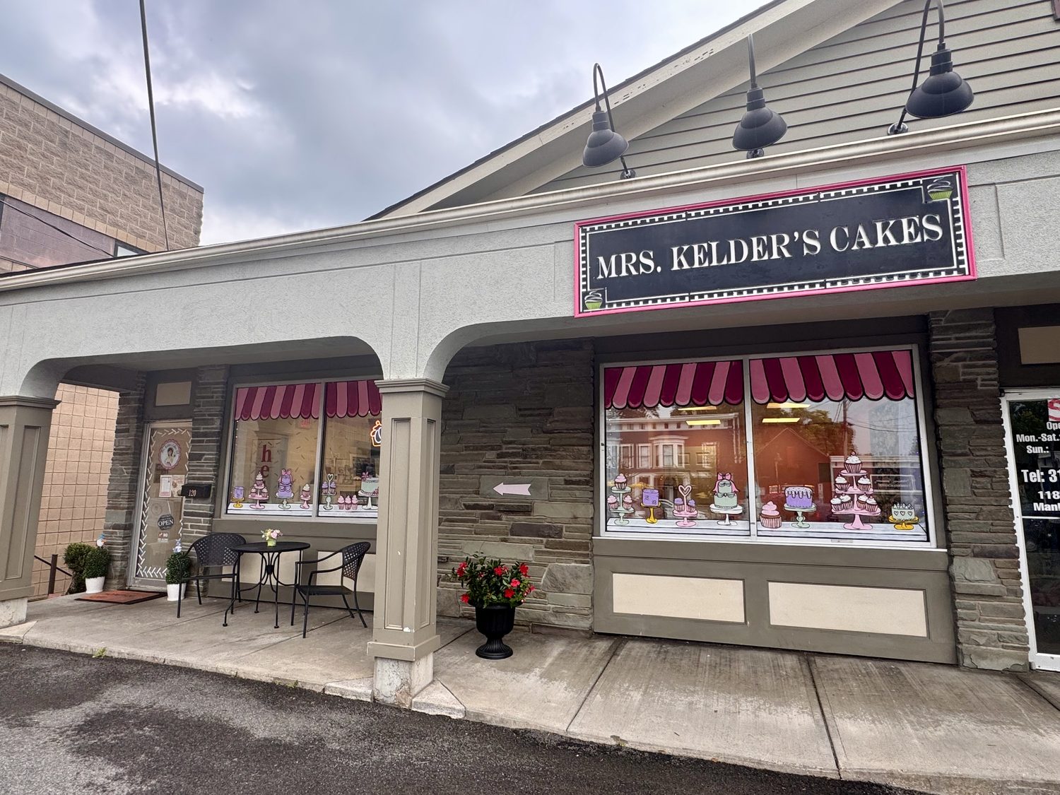 The Mrs. Kelder's Cakes storefront on East Seneca Street, with striped awnings and the shop sign above the windows